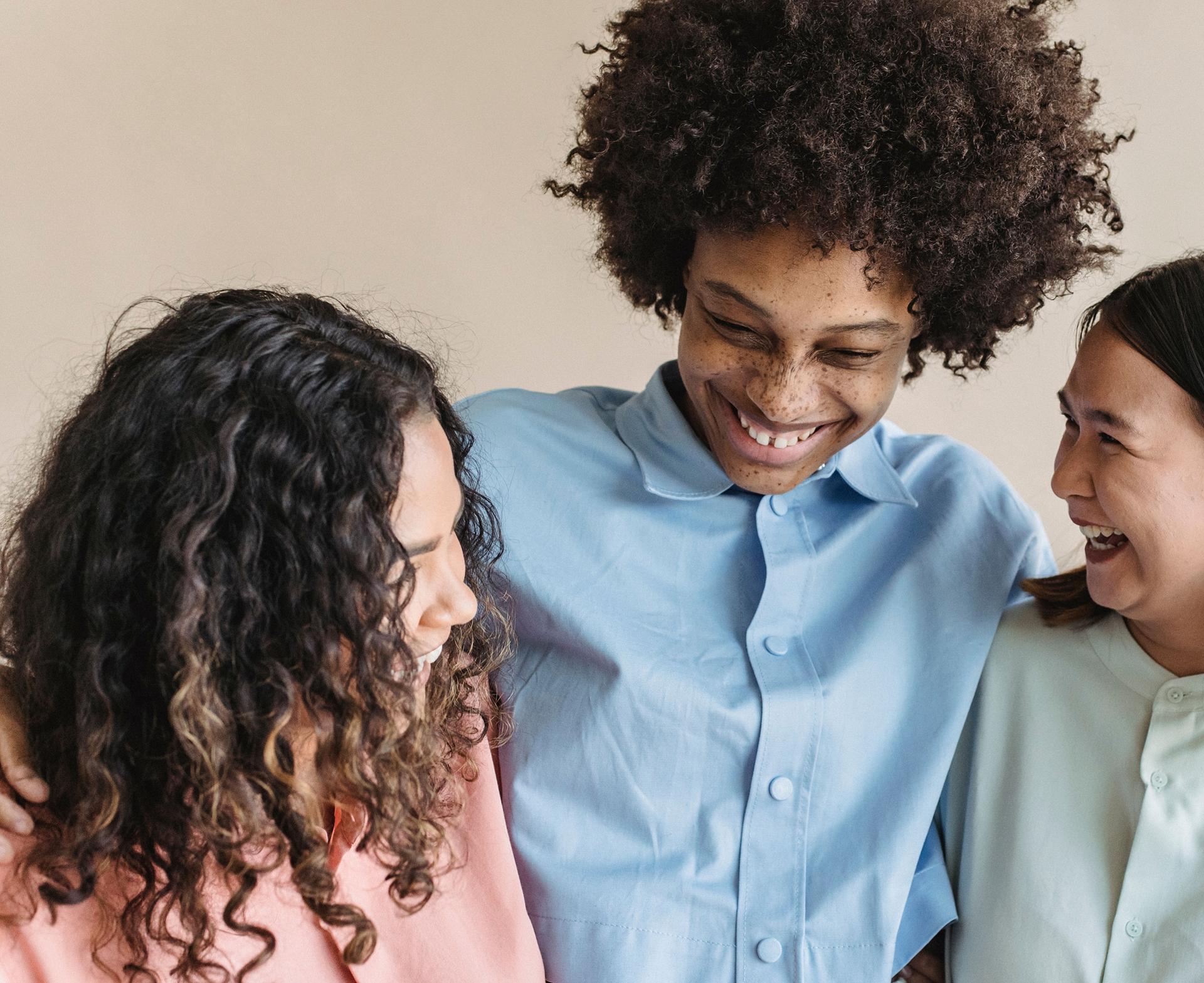 Three people talking and laughing together